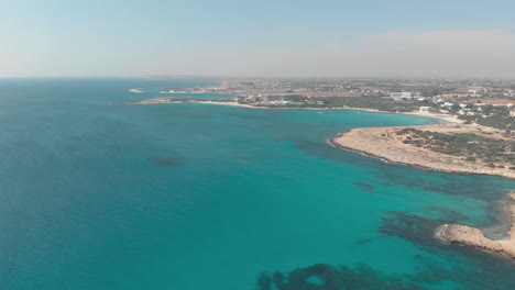 Clear-blue-sea-water-at-nissi-beach---Aerial-View