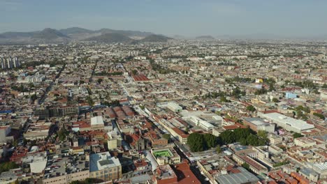 Aerial-View-of-Mexico-City-Neighborhood-During-Daytime,-Dolly-Back-Pan-Up