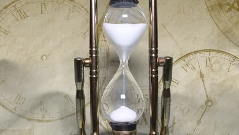 Close-up-of-a-transparent-hourglass.-Time-concept