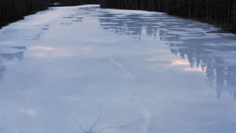 Aerial-drone-video-of-icy-lake-with-some-water-on-the-ice