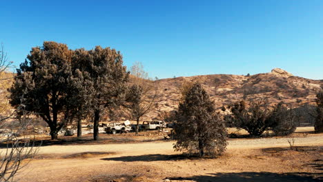 Landscape-home-and-cars-destroyed-by-Southern-California-wildfires---panoramic