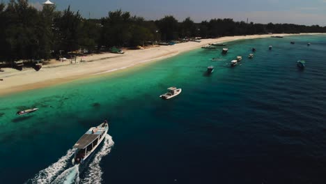 aerial-view-tourist-boat-on-the-beach-from-a-drone