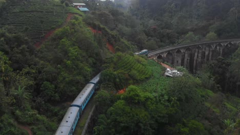 Drone-shot-of-a-Train-goes-along-the-Nine-Arches-Bridge-in-Sri-Lanka