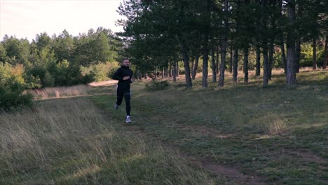 Man-running-on-a-forest-path