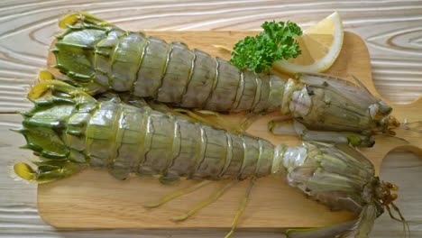 fresh-mantis-shrimp-with-lemon-on-wood-board