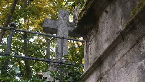 an-old-cross-made-of-stone-in-the-pere-lachaise-cemetary
