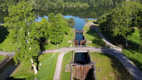 Inoperative-aged-staircase-lock-in-Sweden-surrounded-by-green-forest,-aerial