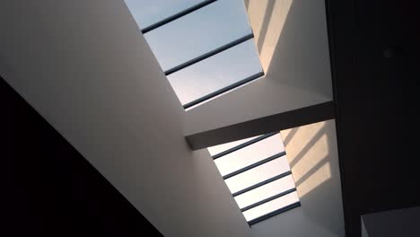 Abstract-shot-looking-up-at-sky-light-window-in-modern-building-3