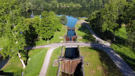 Gamle-Dal-staircase-lock-out-of-service-on-outskirts-of-Trollhättan,-aerial