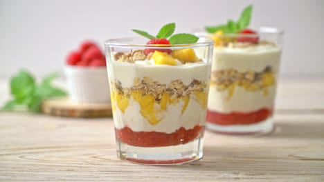 homemade-fresh-mango-and-fresh-raspberry-with-yogurt-and-granola---healthy-food-style