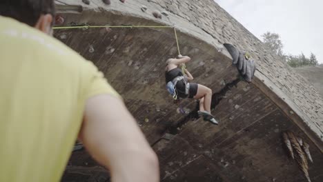 Rock-climber-girl-descending-slowly-La-Foixarda-Barcelona-Spain