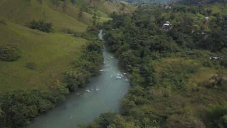 Drone-aerial-flying-over-the-river-in-Guatemala,-central-america
