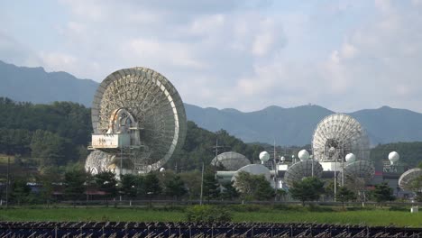 KT-SAT-Satellite-Dishes-In-Kumsan,-South-Korea-At-Daytime---zoom-out-shot