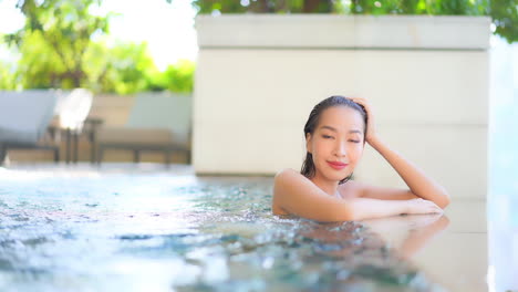 Young-Sexy-Asian-Woman-Enjoying-in-Swimming-Pool-and-Looking-Seductive-at-Camera-Slow-Motion-Full-Frame