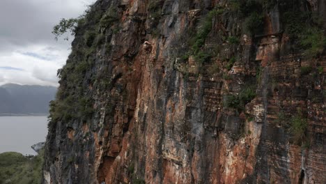 Woman-rock-climbing-Shuanglang-Dali-beautiful-rock-face,-China-tourism