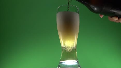 A-hand-pouring-beer-on-a-glass