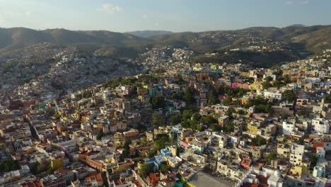 Drone-Reveals-Beautiful-Guanajuato-City-Built-into-Mountains,-Daytime-in-Mexico