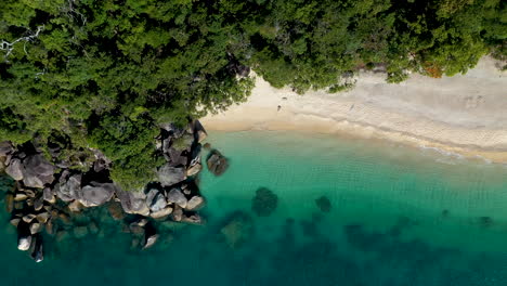 Rising-cinematic-drone-shot-of-clear-ocean-water-at-Fitzroy-Island-in-Australia