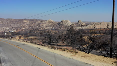 Landscape-destroyed-by-the-Bobcat-wildfire-in-Southern-California---aerial-pull-back-view