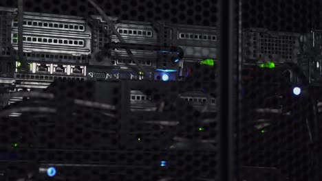 Flashlight-of-thief-shining-on-a-data-server-rack