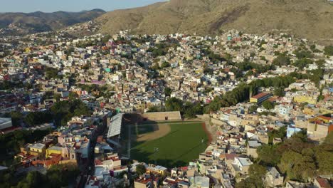 Baseball-Stadium-Built-into-Mountain-City-Landscape,-Guanajuato,-Mexico