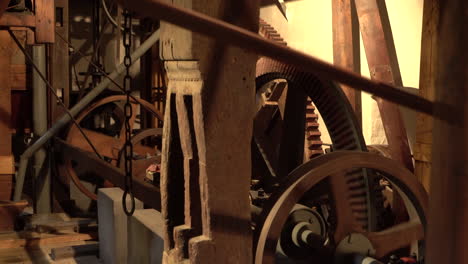 Spinning-Cogwheels-Gear-Wheels-with-transmission-in-wooden-old-Mill