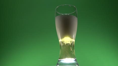 Foam-of-beer-slowly-ascending-on-a-glass-of-beer