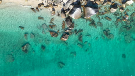 Rising-drone-shot-of-clear-ocean-water-at-Fitzroy-Island-in-Australia