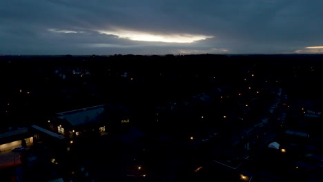 Jib-up-over-dark-town-in-the-early-morning-with-the-sun-rising-behind-the-clouds