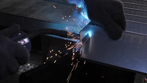 Close-up-work-with-metal-steel-and-iron-using-a-welding-machine
