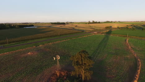 Argentinian-Countryside,-Aerial-View-of-Rural-Farming-Landscape-on-a-Golden-Hour-Sunlight,-Drone-Shot