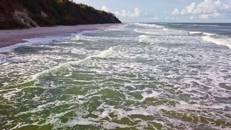 Sea-Waves-On-Sandy-Beach-Aerial-Slowmotion-Shot