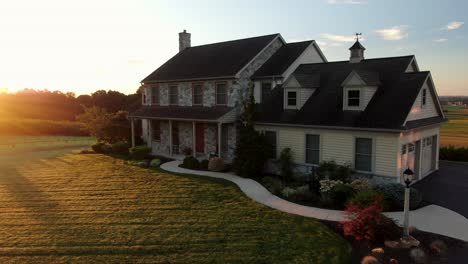 Large-stone-farm-house-during-quiet-morning-sunrise-in-USA