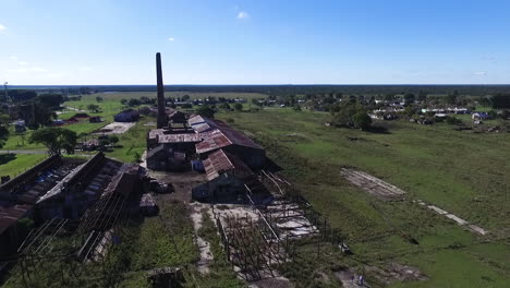 Flying-Above-Old-Abandoned-Wood-Work-Factory,-Countryside-Landscape-of-Argentina-Aerial-View