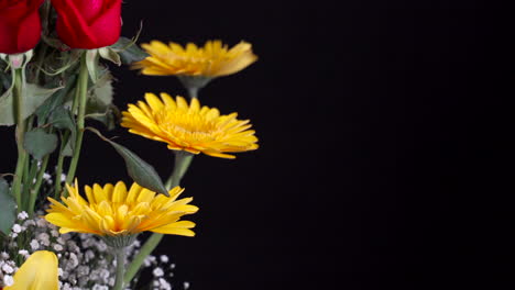 Flower-arrangement-detail-shot-panning-black-background