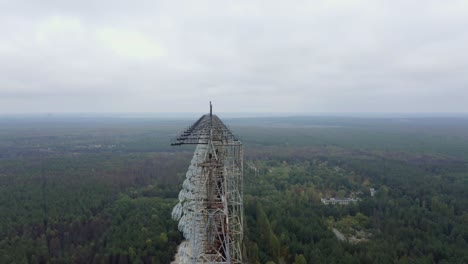 Enormous-Duga-Radar-Antenna-In-The-Forest-Near-Chernobyl-In-Pripyat,-Ukraine---orbiting-drone-shot
