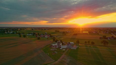 Aerial-View-of-Sunset-over-Amish-Farmlands-in-Pennsylvania-in-June