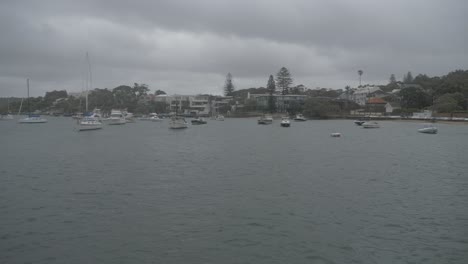 Sailboats-And-Yachts-Anchored-In-The-Ocean-On-A-Gloomy-Day---Watsons-Bay-In-Sydney,-New-South-Wales,-Australia