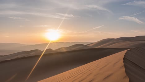 Incredible-time-lapse-of-sun-rising-over-Majestic-Abu-Dhabi-desert-sand-dunes-on-clear-day