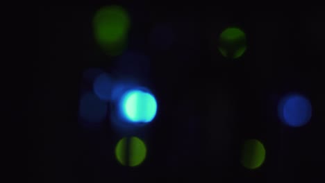 Vertical-view-of-blurred-green-and-blue-data-server-dots