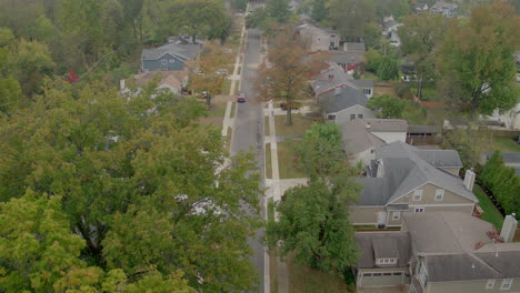 Aerial-of-a-middle-class-suburban-neighborhood-on-a-pretty-Fall-day-tracking-right