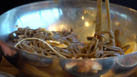 Eating-Delicious-Korean-Buckwheat-Noodles-With-A-Pair-Of-Chopsticks---super-close-up