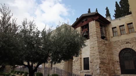 Church-tower-bell-in-the-Gethsemane-Garden-and-olive-trees,Jerusalem,-Israel