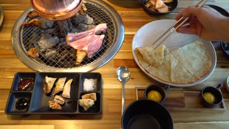 Traditional-Korean-barbecue-table-with-several-popular-dishes-in-restaurant
