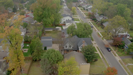 Aerial-tracking-left-over-suburban-streets-and-houses-in-a-pretty-St