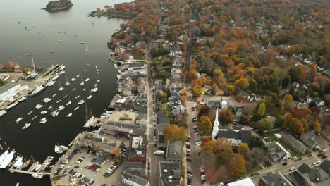 Flying-over-downtown-Camden-and-harbor-toward-woodland-by-the-coast