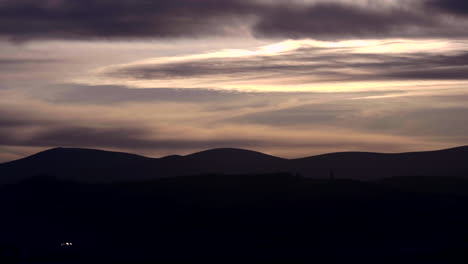 Scenic-View-Of-Sky-During-Sunset-Over-Mountain-Ridges-Silhouette-In-South-Ireland-Near-Dublin