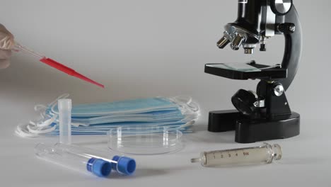 Medical-Pipette-with-red-Fluid:-Coronavirus-Covid-19-Conceptual-Vaccine---Slow-Motion