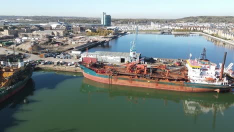 Ships-moored-in-Dock-on-river-Medway-St-Marys-Island-Aerial-footage