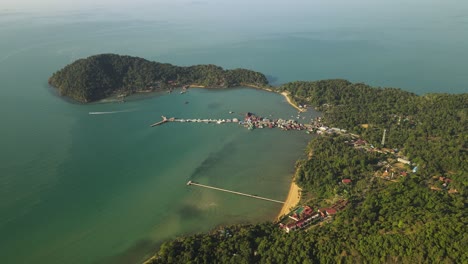 Still-aerial-view-high-above-Bang-Bao-pier-and-the-rainforest-of-Koh-Chang,-Thailand